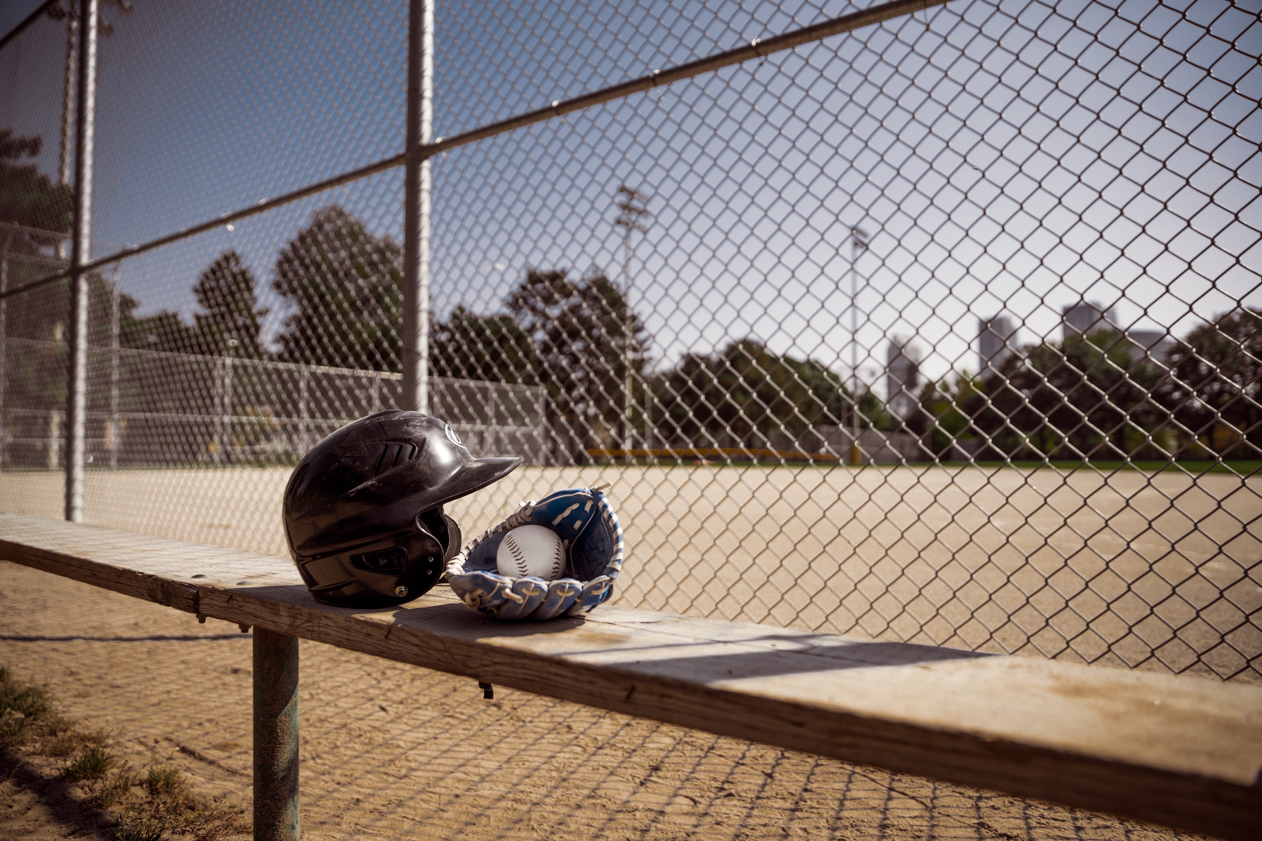 baseball-gear-behind-fence.jpg
